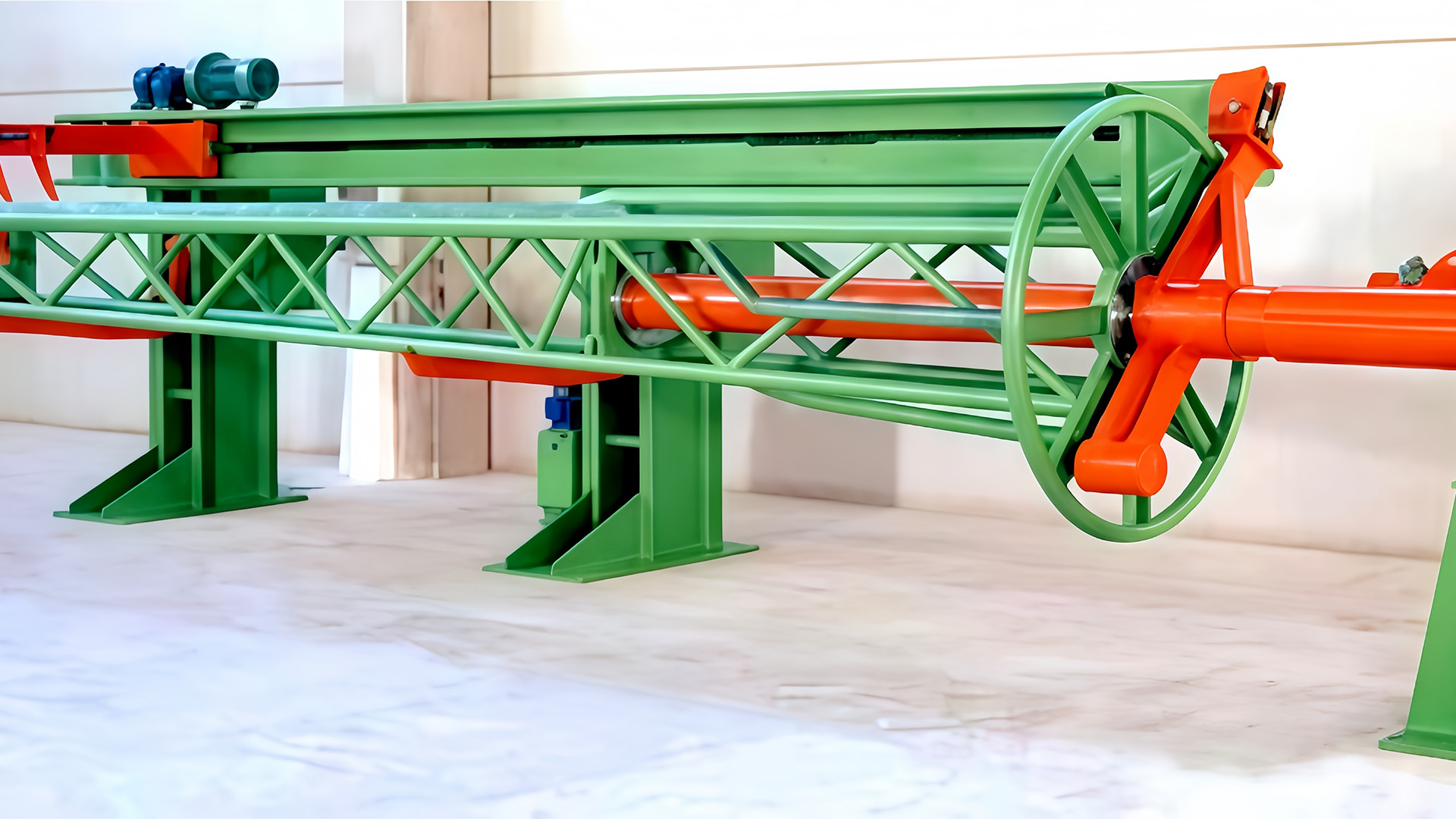 How does the design of the Elevated Pay-Off Rack prevent slippage or instability when loading or unloading heavy coils or reels?